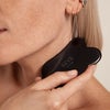 Model Using Gua Sha Body Massage Tool 